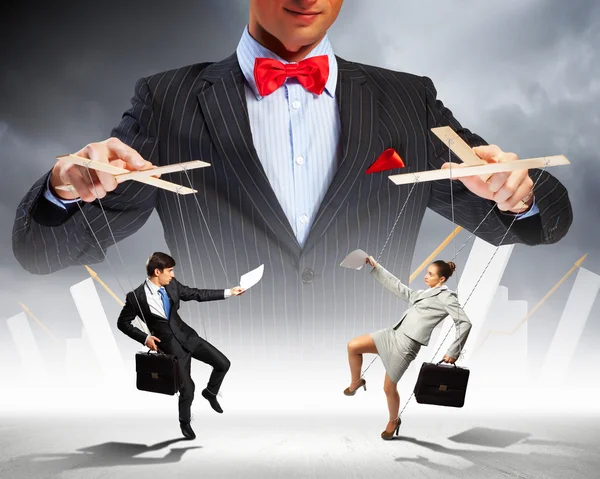 Businessman puppeteer — Stock Photo, Image