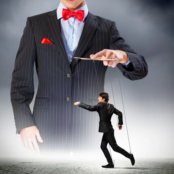 Businessman puppeteer — Stock Photo, Image