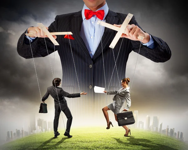 Businessman puppeteer — Stock Photo, Image