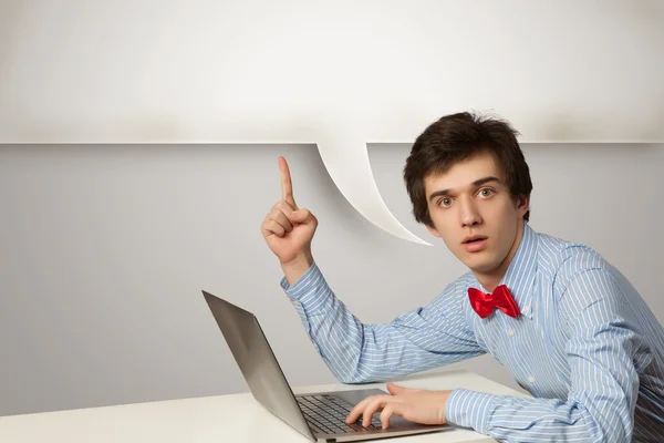 Young man with laptop — Stock Photo, Image