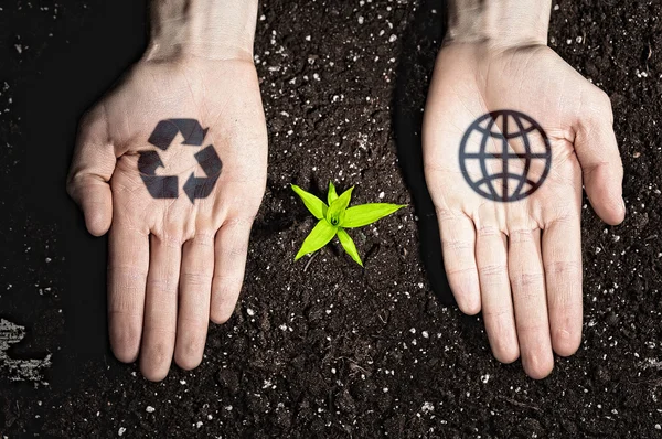 Menselijke handen en ecologie symbolen — Stockfoto