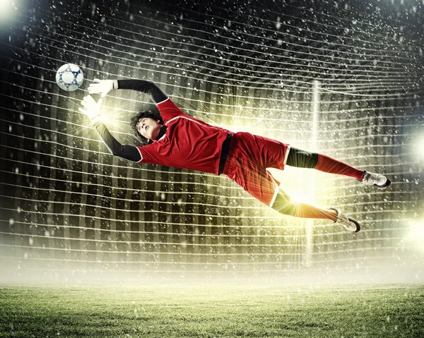 Goalkeeper catches the ball — Stock Photo, Image