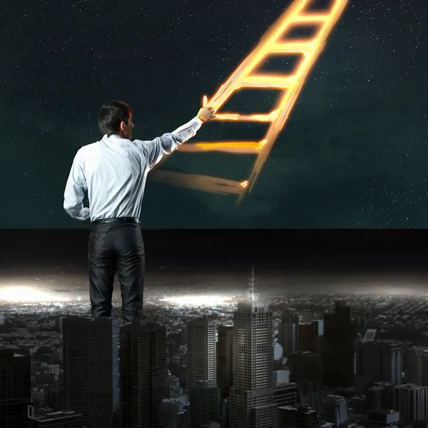 Businessman drawing ladder — Stock Photo, Image
