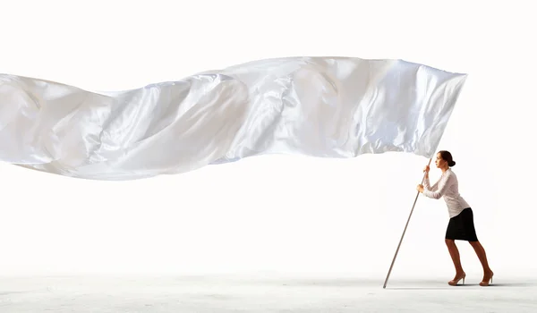 Businesswoman holding white flag — Stock Photo, Image