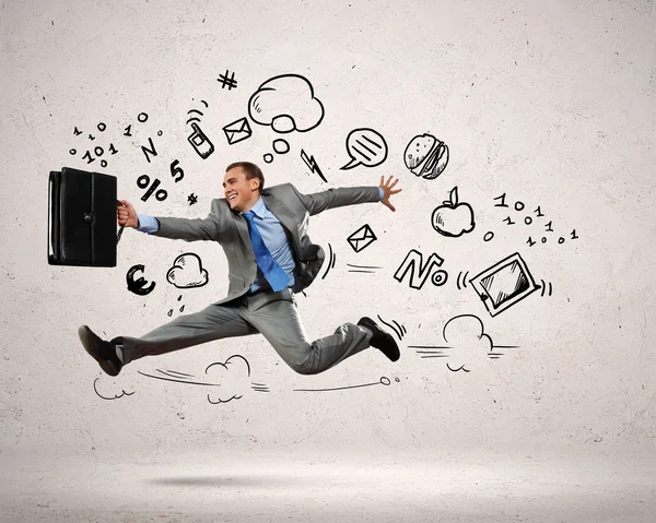 Jumping young businessman — Stock Photo, Image