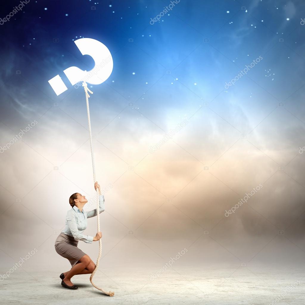 Woman pulling rope with a question mark