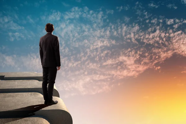 Businessman on top of building — Stock Photo, Image