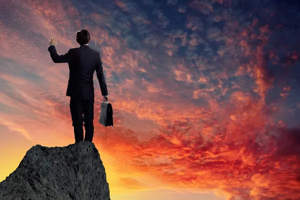 Businessman on top of hill — Stock Photo, Image