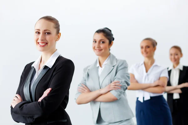 Four businesswomen standing in row — Stock Photo, Image