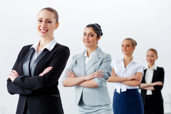 Four businesswomen standing in row — Stock Photo, Image