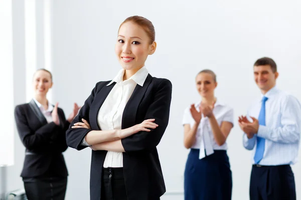 Four businesswomen standing in row — Stock Photo, Image