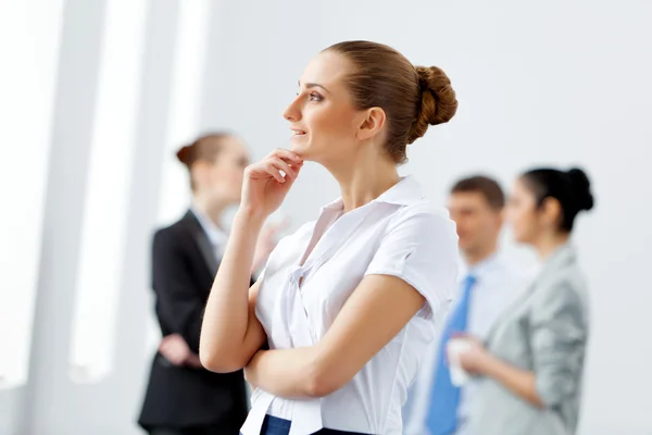 Four businesswomen standing in row — Stock Photo, Image