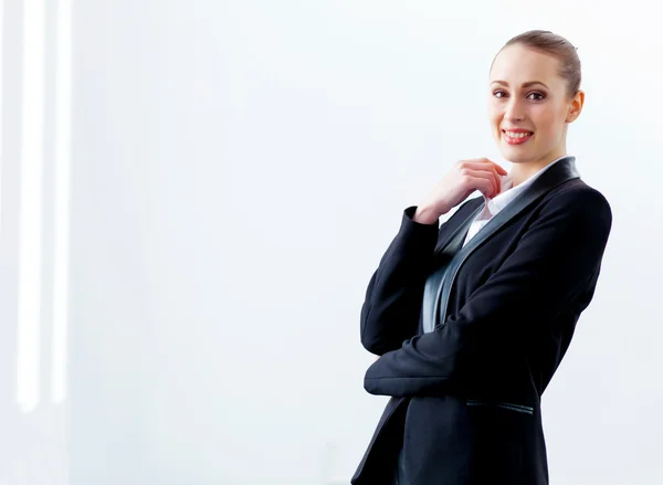 Attractive businesswoman in black suit — Stock Photo, Image