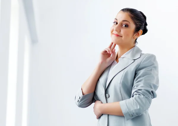 Attractive asian businesswoman in grey suit — Stock Photo, Image