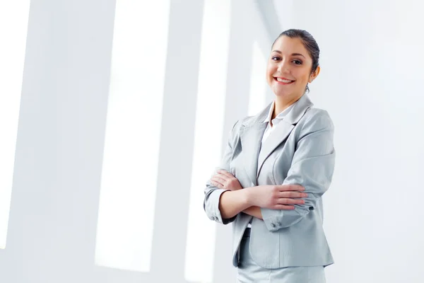 Attractive asian businesswoman in grey suit — Stock Photo, Image