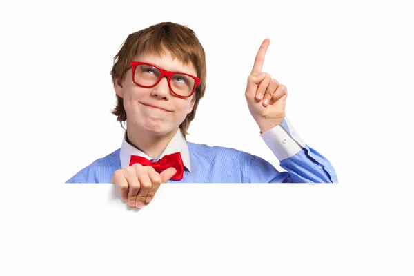 Boy in red glasses holding white square — Stock Photo, Image