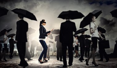 Businesswoman in blindfold among group of clipart