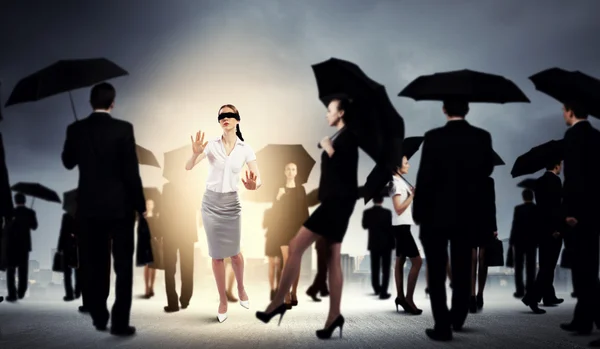 Businesswoman in blindfold among group of — Stock Photo, Image