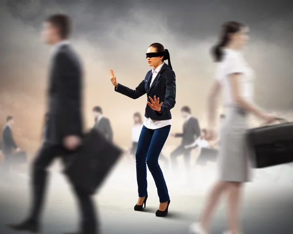 Businesswoman in blindfold among group of — Stock Photo, Image