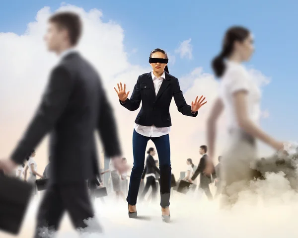 Businesswoman in blindfold among group of — Stock Photo, Image