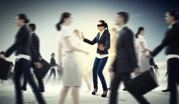 Businesswoman in blindfold among group of — Stock Photo, Image