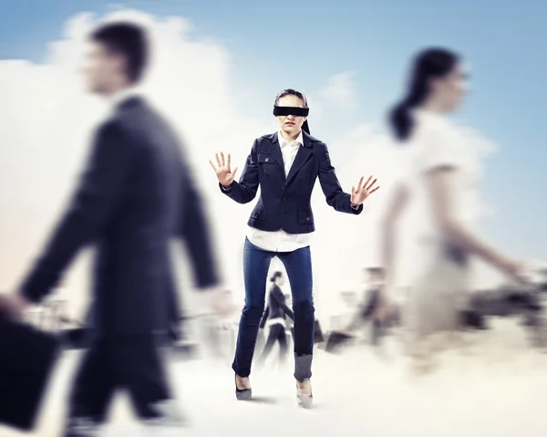 Businesswoman in blindfold among group of — Stock Photo, Image