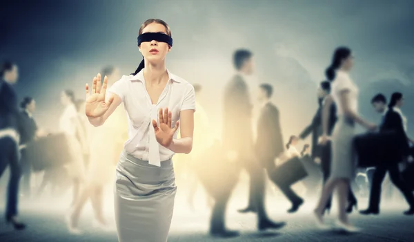 Businesswoman in blindfold among group of — Stock Photo, Image