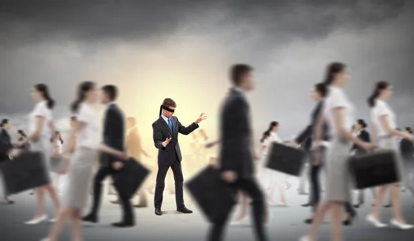 Businessman in blindfold among group of — Stock Photo, Image