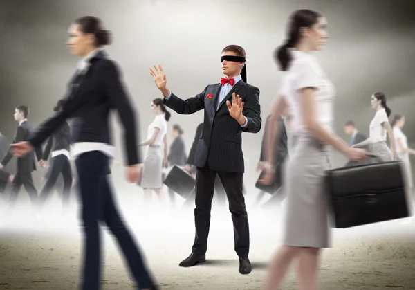 Businessman in blindfold among group of — Stock Photo, Image