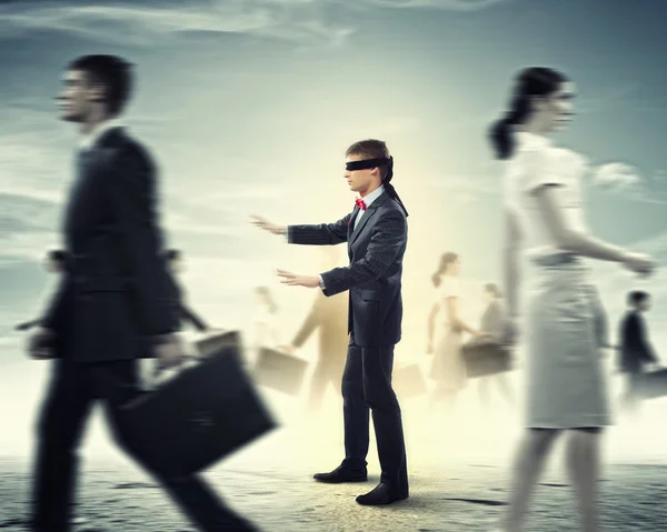 Businessman in blindfold among group of — Stock Photo, Image