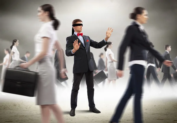 Businessman in blindfold among group of — Stock Photo, Image