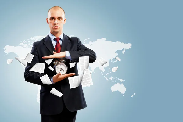 Business man holding alarmclock — Stock Photo, Image