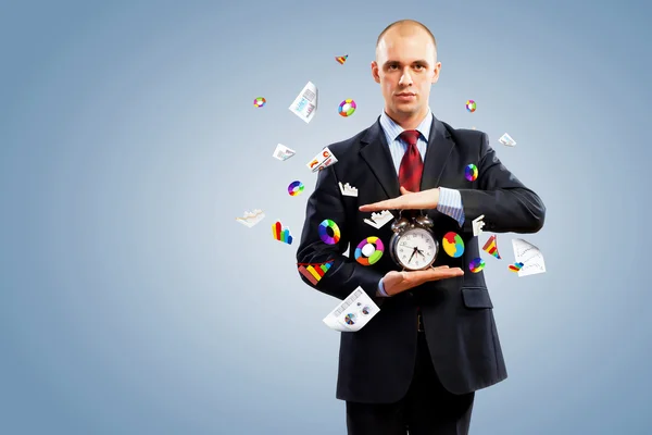 Business man holding alarmclock — Stock Photo, Image