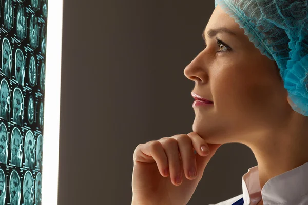 Woman doctor examining x-ray — Stock Photo, Image