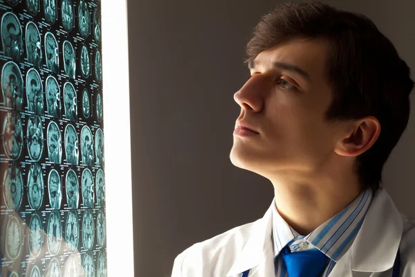 Man doctor looking at x-ray — Stock Photo, Image