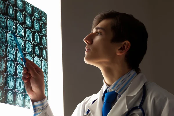 Man doctor looking at x-ray — Stock Photo, Image