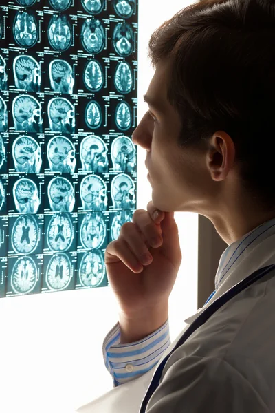 Man doctor looking at x-ray — Stock Photo, Image