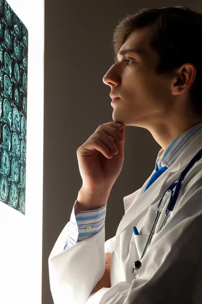 Man doctor looking at x-ray — Stock Photo, Image