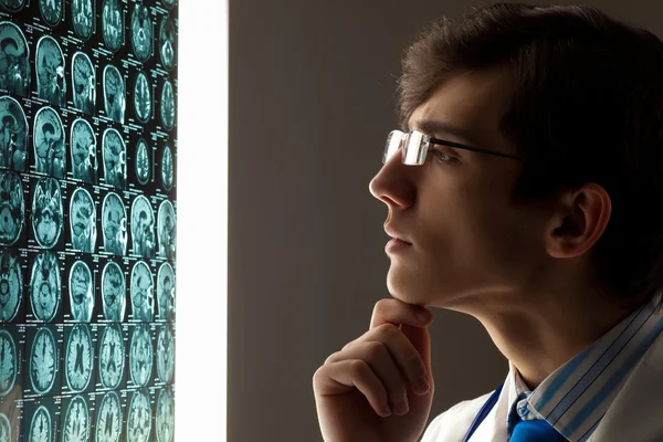 Man doctor looking at x-ray — Stock Photo, Image