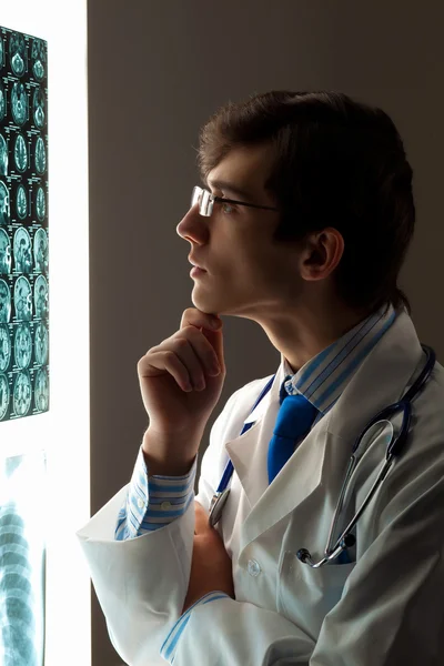 Man doctor looking at x-ray — Stock Photo, Image