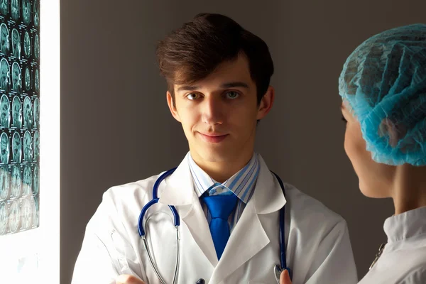 Two doctors examining x-ray results — Stock Photo, Image