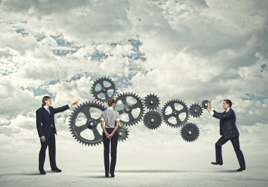 iş insanları ve mekanizma elemanları