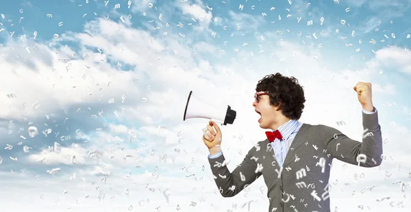 Young man with megaphone — Stock Photo, Image