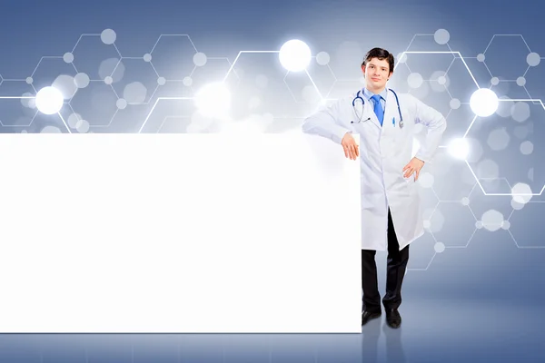 Male doctor with banner — Stock Photo, Image