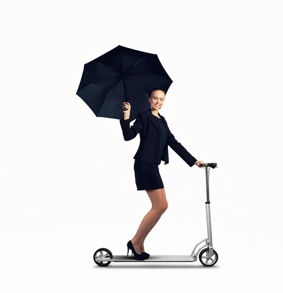 Mujer de negocios montando scooter —  Fotos de Stock