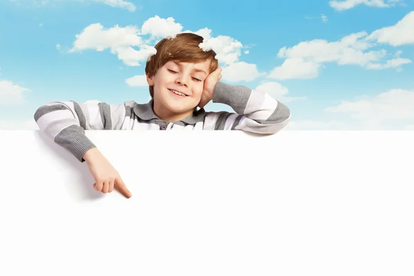 Boy with a blank billboard — Stock Photo, Image