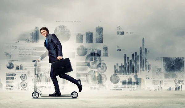 Businessman riding scooter — Stock Photo, Image