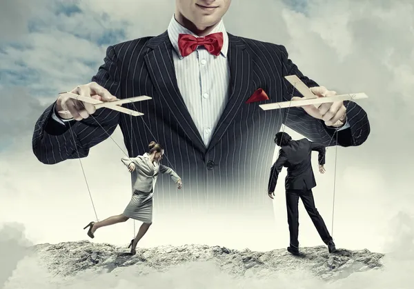 Businessman puppeteer — Stock Photo, Image