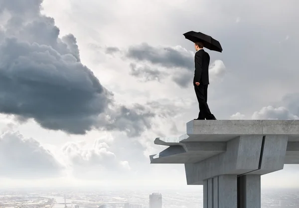 Businessman standing on bridge — Stock Photo, Image