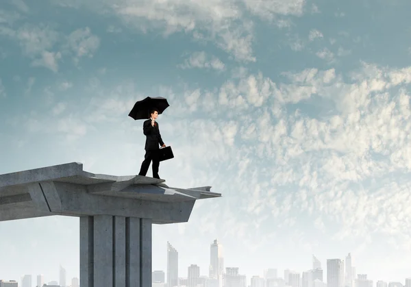 Businessman standing on bridge — Stock Photo, Image